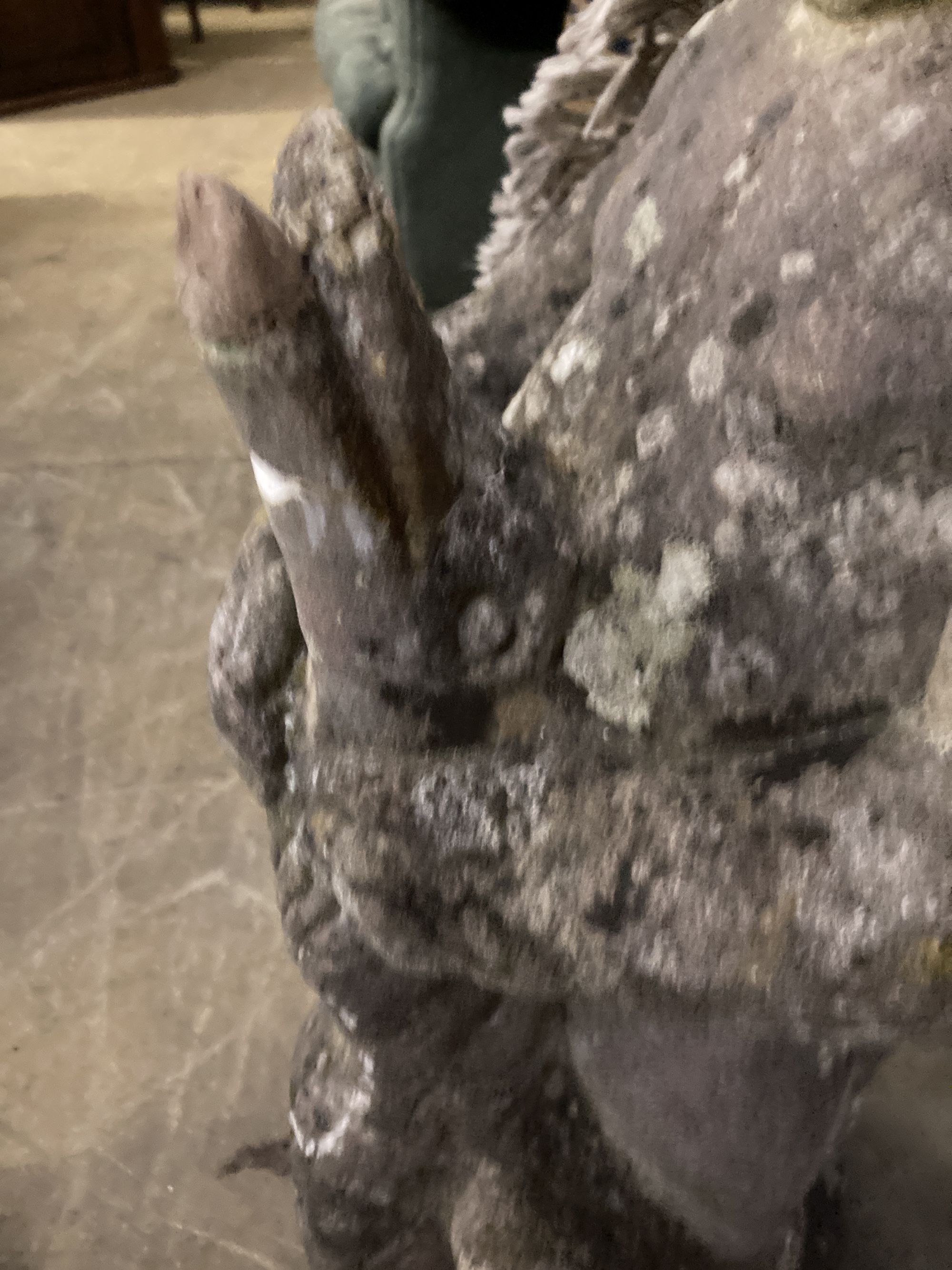 A reconstituted stone garden ornament of a putto with swan, height 68cm